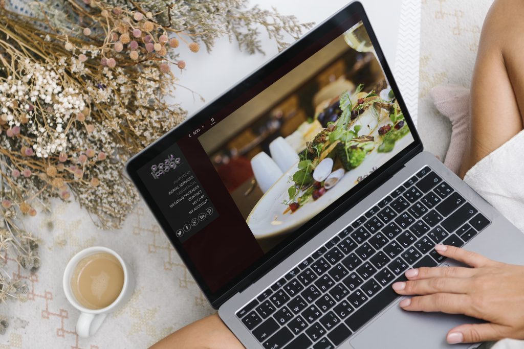 Commercial website imagery displayed on a laptop